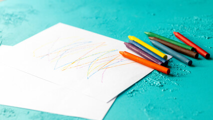 Close-Up of Pastel Crayons and Sketchbook