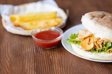 Close-Up of Turkish Chicken Doner Served with French Fries in Bread