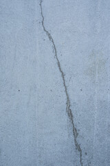 close to concrete and a crack in it, gray
