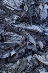 pieces of black cut leather in production