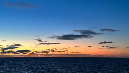 Vibrant ocean sunset with colorful sky and calm horizon