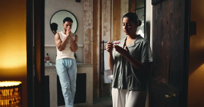 Couple, anxiety and waiting with pregnancy test for medical results, news or anticipation in home. Woman, man and stress with infertility, maternity stick or reading for accuracy, ovulation or exam