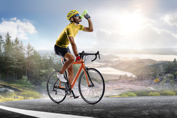 Cycling. A captivating shot of a helmeted biker riding along an asphalt road, demonstrating the freedom and excitement of road riding. Cycling competitions. Active recreation. Sport.