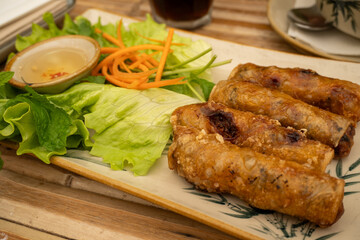 Delicious Vietnamese Fried Spring Rolls with Fresh Salad.