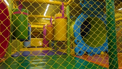 Engaging obstacle course with cushioned surfaces and colorful pillars