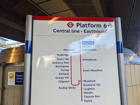 London Underground Central line eastbound route map and station sign on a platform at Stratford