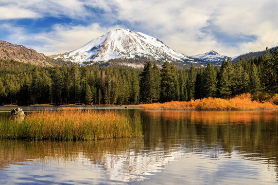 Autumn At Mount Lassen With A Reflection and A Snow Capped Mountain With Golden Colors