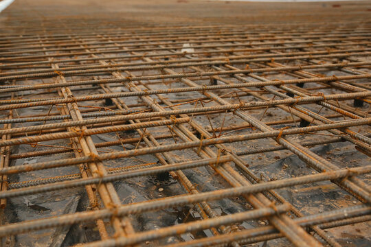 Tied rebar grid prepared for a building foundation, ready for concrete pouring at a construction site