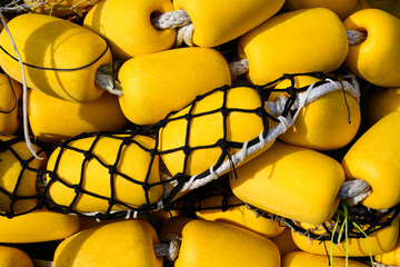 Commercial industrial fishing net and yellow floats in closeup