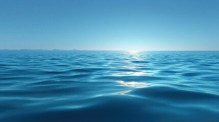 Obraz premium Calm and Tranquil Ocean Surface with Soft Waves Reflecting Light Under Clear Blue Sky at Daytime