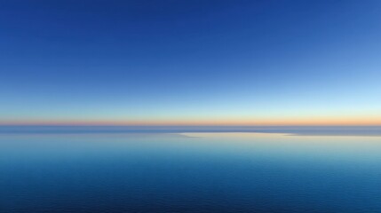 Obraz premium Serene Horizon Over Calm Ocean at Dawn with Clear Blue Sky and Gentle Reflection on Water Surface in Tranquil Atmosphere and Nature's Beauty
