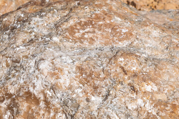 Close-up of natural rock with crystal formations and rough texture