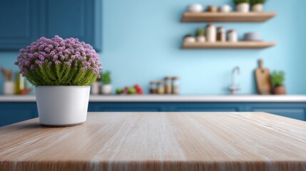 Fototapeta premium Cozy kitchen interior featuring a vibrant purple flower pot on a wooden table with blue cabinetry and shelves adorned with kitchenware and greenery