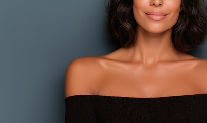 Female shoulders and collarbone in a minimalist setting with soft lighting and blurred backdrop for creative expressions