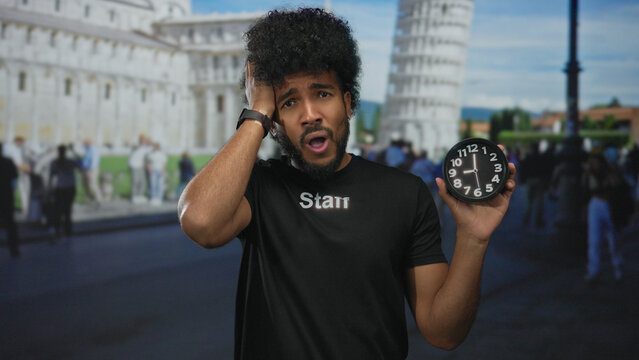 Man in a staff uniform holding a clock in front of the iconic leaning tower of pisa, showcasing a blend of culture and time pressure in the vibrant city setting. - Powered by Adobe