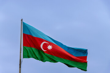 Baku, Azerbaijan. Azerbaijan Flag Waving in Clear, Blue Sky.