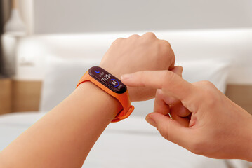 Smart band displaying sleep duration in a calm bedroom environment, emphasizing wellness monitoring and healthy rest habits