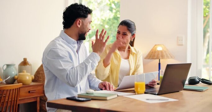 Happy, high five and couple with paperwork, home and excited for successful loan application on web. Talking, man and woman with laptop for mortgage, celebration and financial planning with documents