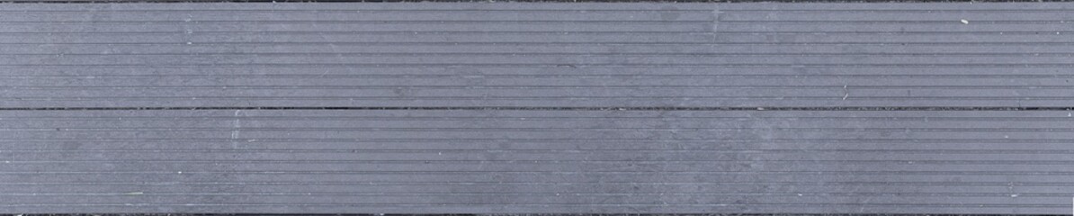 Texture of gray plastic planks for outdoor bridges and decks non slip