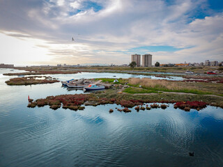 Fototapeta premium Serene Waterscape with Boats at Dusk