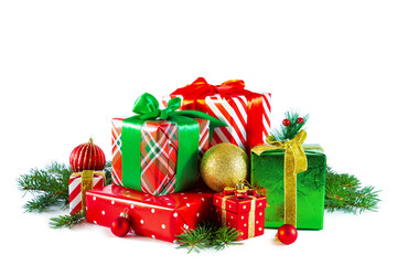 Elegant red and green gift boxes with Christmas balls and fir branches.