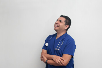 Dark-skinned Latino male doctor specialist with a stethoscope shows pride and success in his work for the health of patients