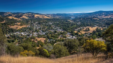 Fototapeta premium Panoramic View of Lush Green Valley Surrounded by Rolling Hills and Blue Sky on a Sunny Day, Capturing Natural Beauty and Scenic Landscape