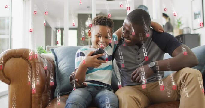 Dad and son sitting on couch son tapping phone causing binary graphic showing tech and learning