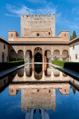 Fototapeta premium Reflections of Comares Tower in the Alhambra's central pool