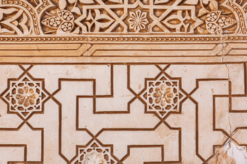 Close-up view of intricate geometric plasterwork in Alhambra, Granada