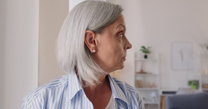 Worried senior retired woman thinking pondering, anxious unhappy, elder mature grey haired lady doing at home, female suffering from mental psychological personal problems, negative thoughts
