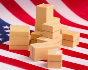 Parcels with goods against the backdrop of the US flag