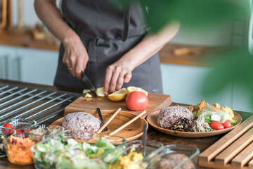 A housewife preparing a one-plate lunch in the kitchen
