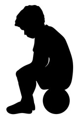 Boy sitting on the ball showing frustration after a failed play, emotional child silhouette