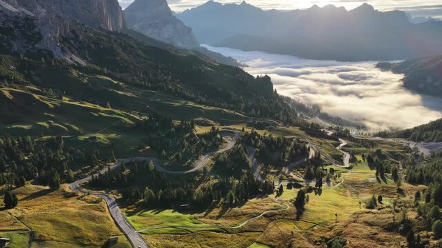 Cinematic aerial video of Gardena Pass in the Italian Dolomites during morning golden hour