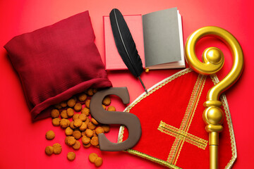 Saint Nicholas (Sinterklaas) day. Mitre, crosier, book, feather, kruidnoten cookies and chocolate...