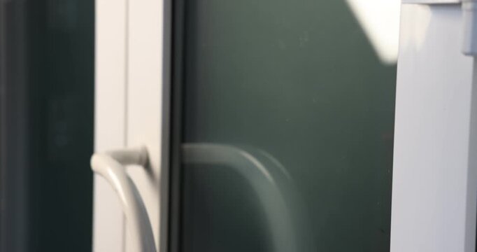 Man knocking on apartment door, closeup view