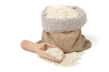 Sticky rice in a jute sack with a wooden spoon to scoop it up. isolated on white background.