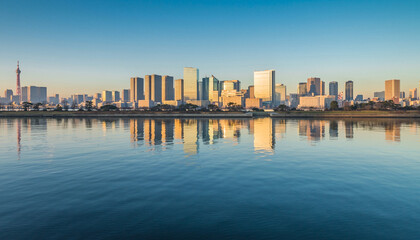 Obraz premium Modern Waterfront Skyline at Sunrise