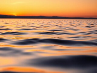Gentle ripples on a serene lake surface at sunset, reflecting warm orange hues,  sky,  scene