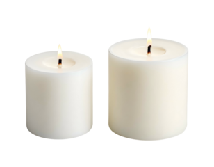 Two lit white pillar candles, one smaller than the other