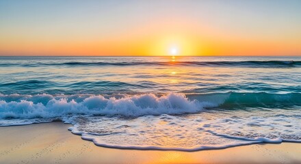 Golden sunset over gentle ocean waves on sandy beach