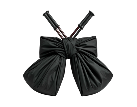 Black satin fabric bow with crossed handles on black