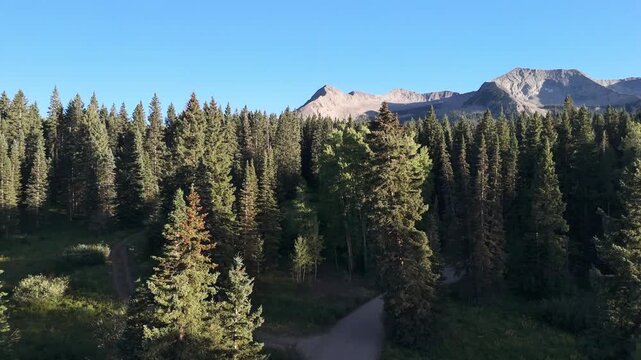 Drone flight at sunset over an alpine lake near Kebler Pass, in Crested Butte, Colorado