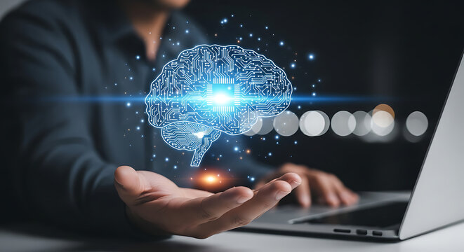 Human hand holding glowing digital brain overlayed on laptop screen - Powered by Adobe