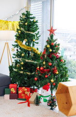 Beautiful christmas tree in living room at home happy new year festival decorations with red golden ornaments for party wrapped presents gift box Season's greetings celebration winter holiday concept.
