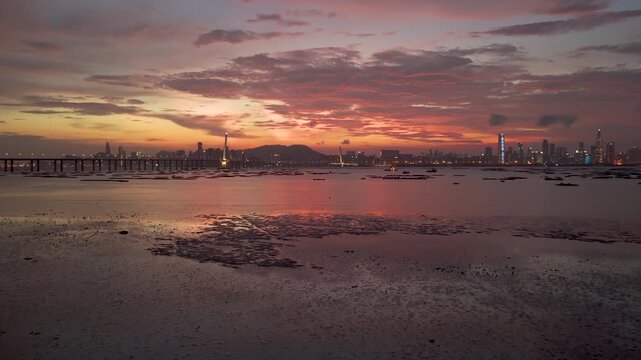 Lau Fau Shan Shoreline Hong Kong and Shenzhen Bay Bridge Aerial sunset 
