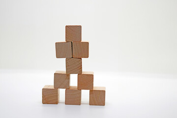 Pyramid of Wooden Toy Blocks on White Background