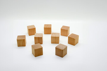 Scattered Wooden Toy Blocks on White Background