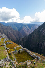 Fototapeta premium The mountains are covered in lush green vegetation and the sky is clear and blue